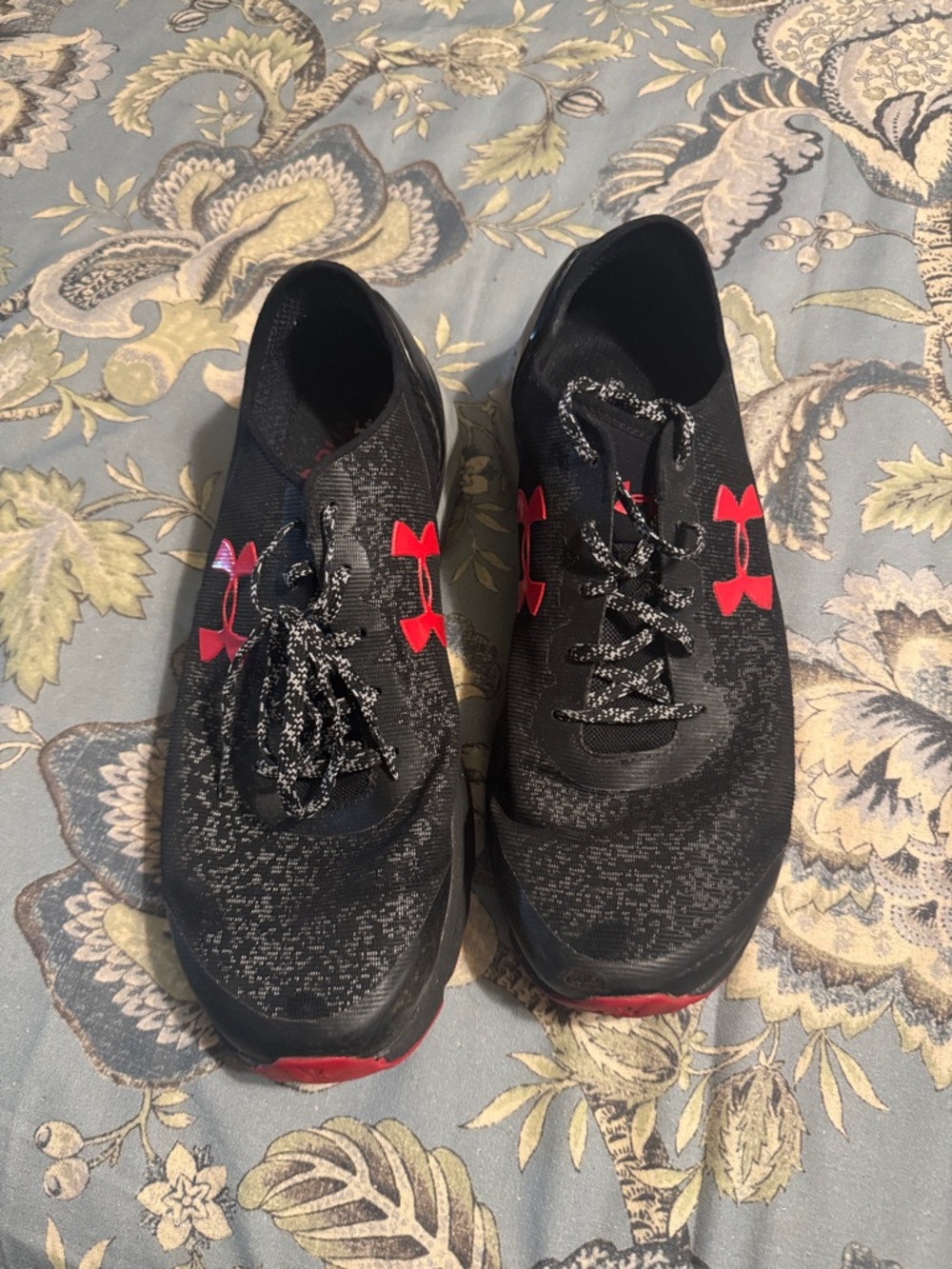 Under Armour Black Athletic Sneakers with Red Logos.  charged on soles